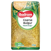 Sentence with Product Name: 1-kilogram package of Bodrum - Coarse Bulgur Wheat (Pilavlık) - 1Kg, labeled as vegan and gmo-free.